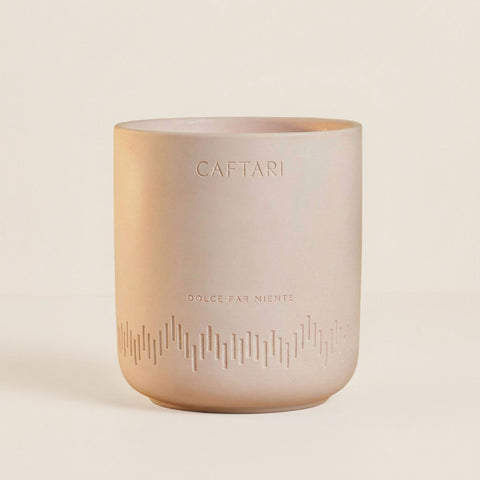 Caftari Dolce Far Niente non-toxic candle in a blush ceramic vessel