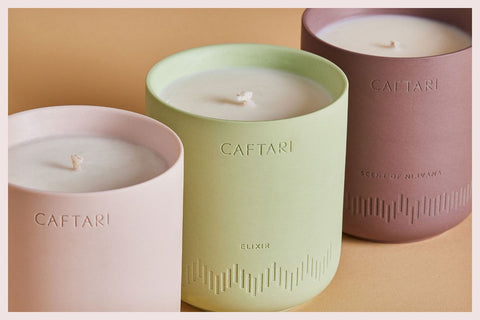 Three Caftari candles styled for a housewarming gift