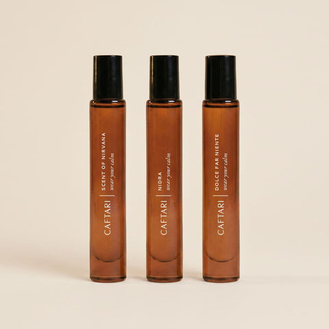 Three Caftari perfume oil rollerballs in the Discovery Set