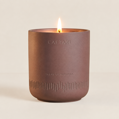 Caftari Scent of Nirvana meditation candle in a mauve ceramic vessel