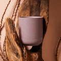 Nirvana essential oil candle woody scent for meditation overhead photo