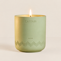 Caftari Elixir candle in a green ceramic vessel